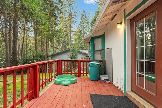 a view of a balcony with wooden floor