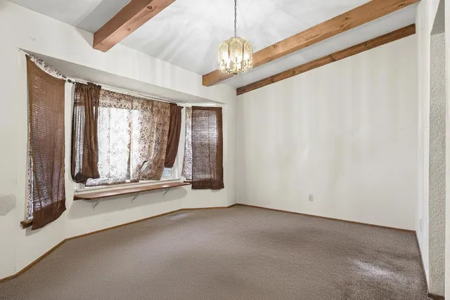 a view of a room with a large window