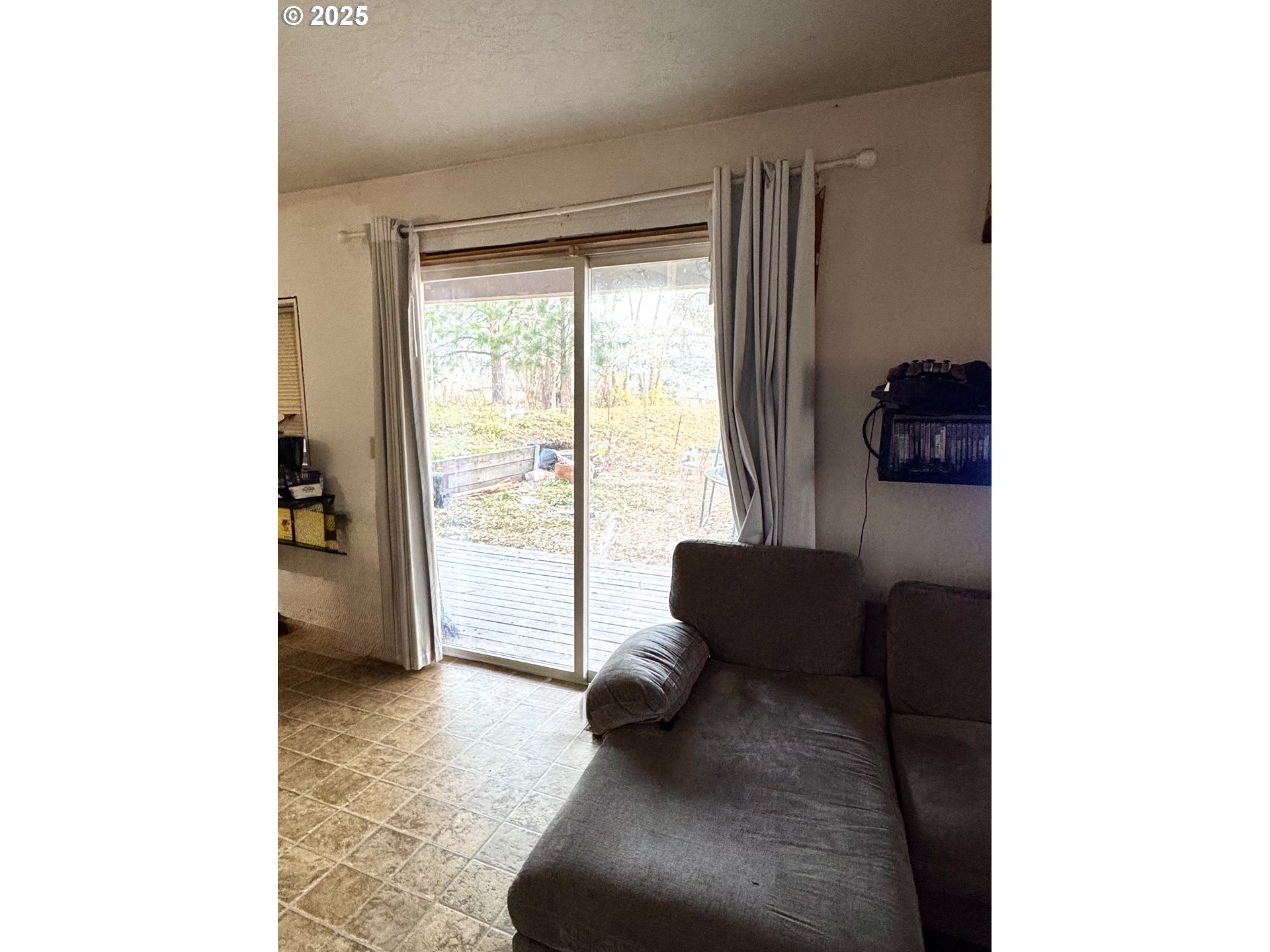 59720 Highway 26 John Day, OR 97845 - Photo 17 of 22 a living room with furniture and a large window