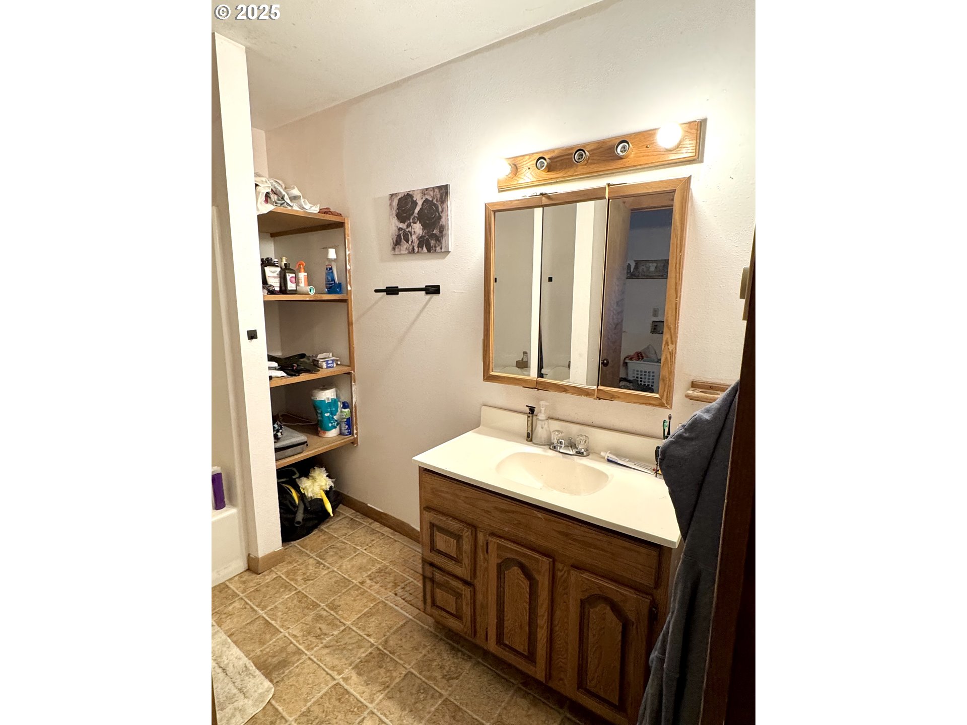 59720 Highway 26 John Day, OR 97845 - Photo 19 of 22 a spacious bathroom with a sink and a mirror