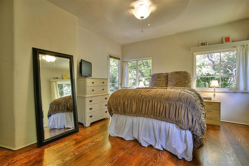 326 Canon Drive Santa Barbara, CA 93105 - Photo 10 of 16 a bedroom with a bed and a mirror