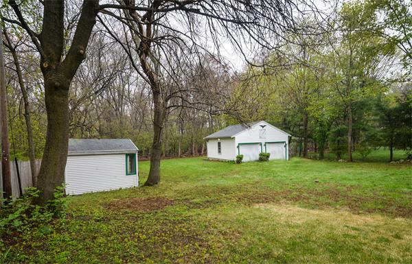 22 Stratford Road Natick, MA 01760 - Photo 18 of 18 a front view of a house with a yard and garage