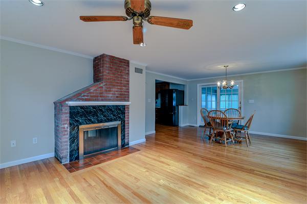 22 Stratford Road Natick, MA 01760 - Photo 3 of 18 a dining room with furniture and fireplace