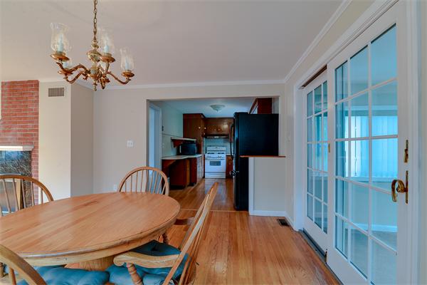 22 Stratford Road Natick, MA 01760 - Photo 9 of 18 a view of a dining room with furniture and wooden floor