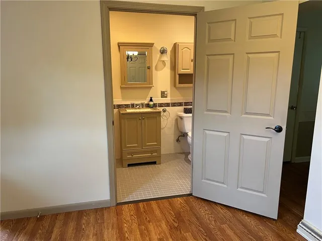 a view of a bathroom with mirror