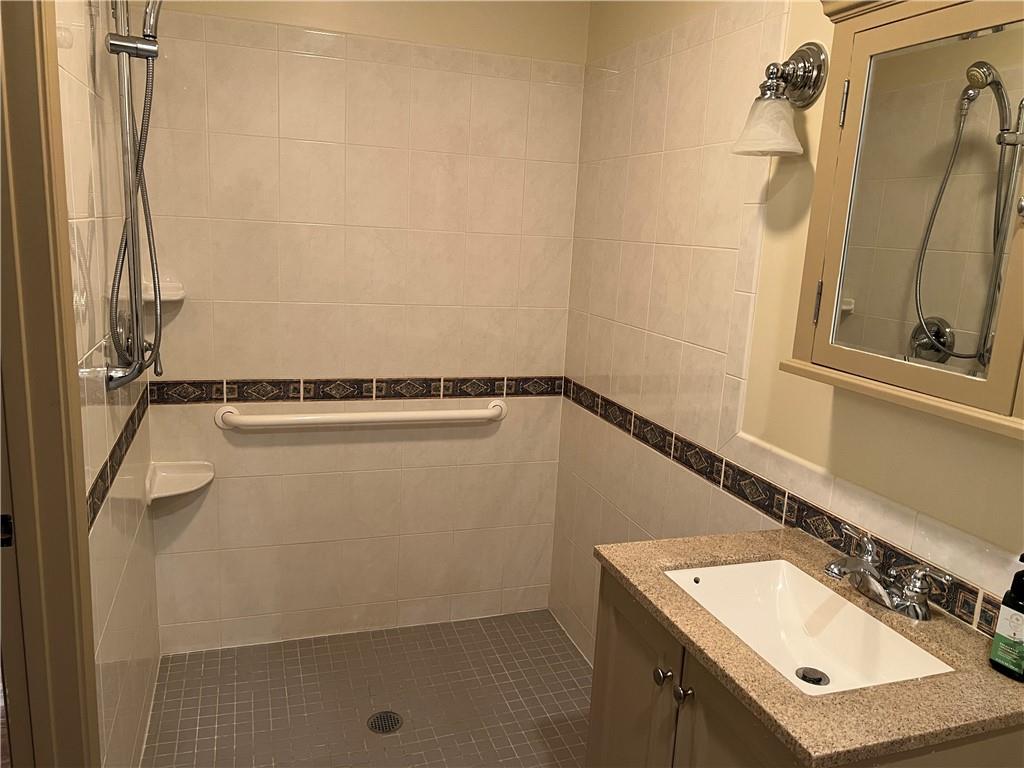 2902 Darlington Road, Unit 1002 Beaver Falls, PA 15010 - Photo 14 of 27 a bathroom with a sink and a mirror