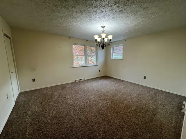 an empty room with a mirror