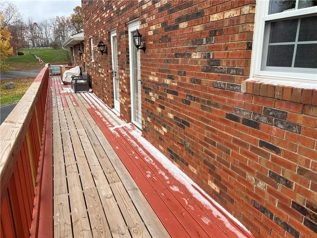 a balcony with view of outdoor space