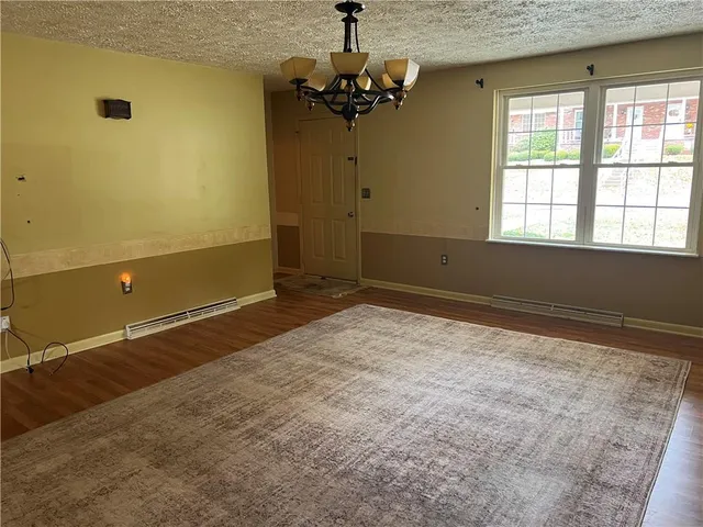 a view of room with a ceiling fan and window