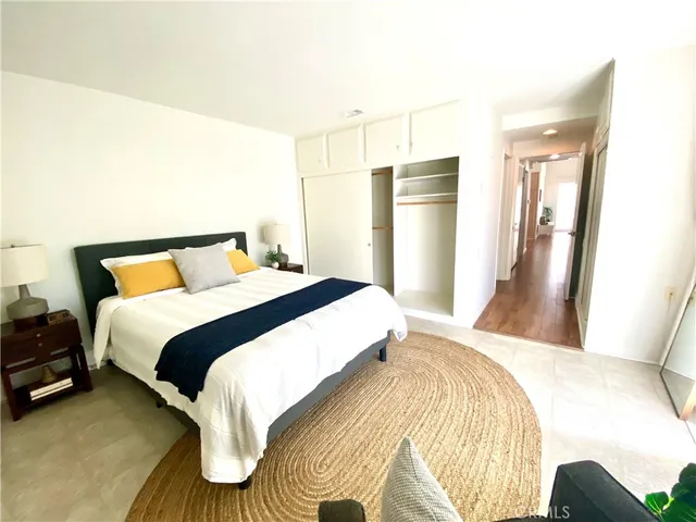 a bedroom with a bed and a couch