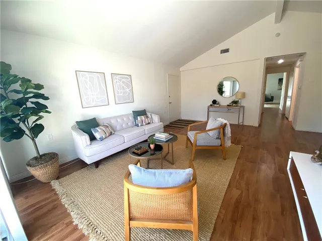 a living room with furniture and a rug