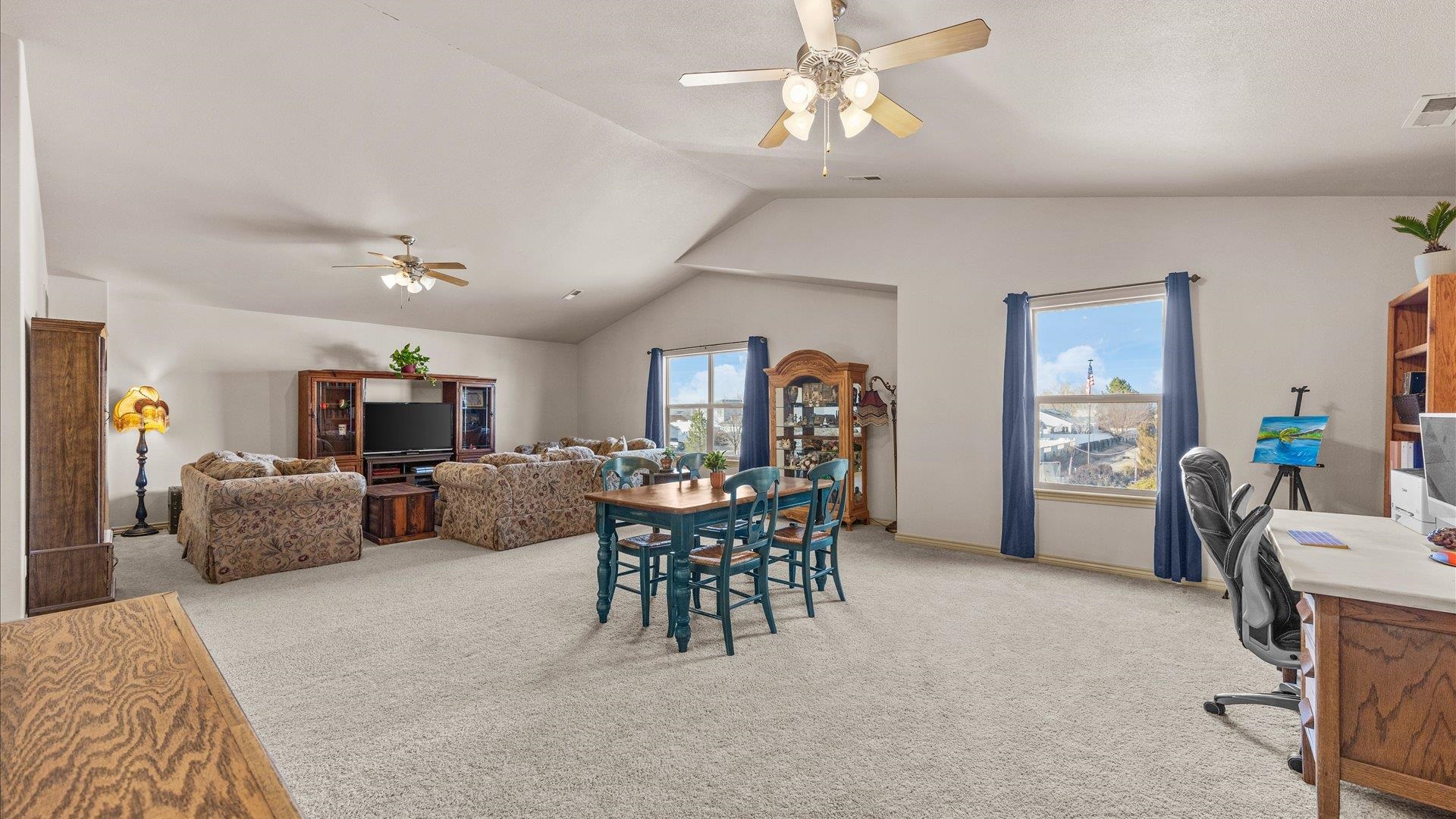 908 Kaley Street Fruita, CO 81521 - Photo 2 of 25 a view of a livingroom with furniture window and wooden floor