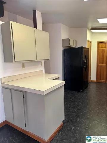 a kitchen with a sink stainless steel appliances and cabinets