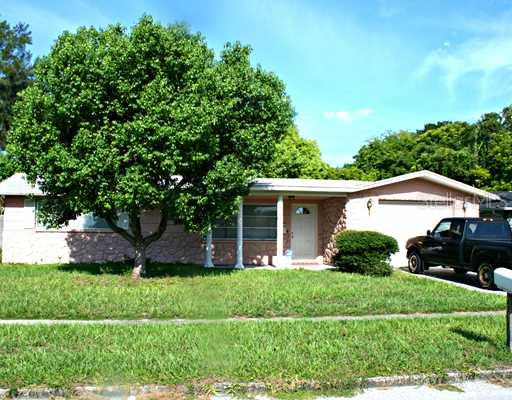 4717 Alcea Street New Port Richey, FL 34652 - Photo 1 of 1 a front view of house with a garden