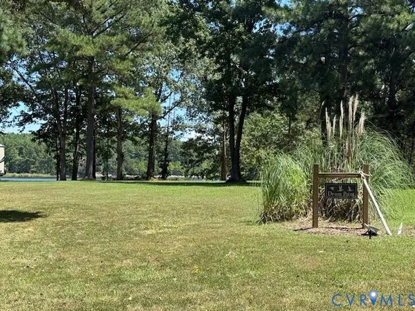 a view of a field with trees