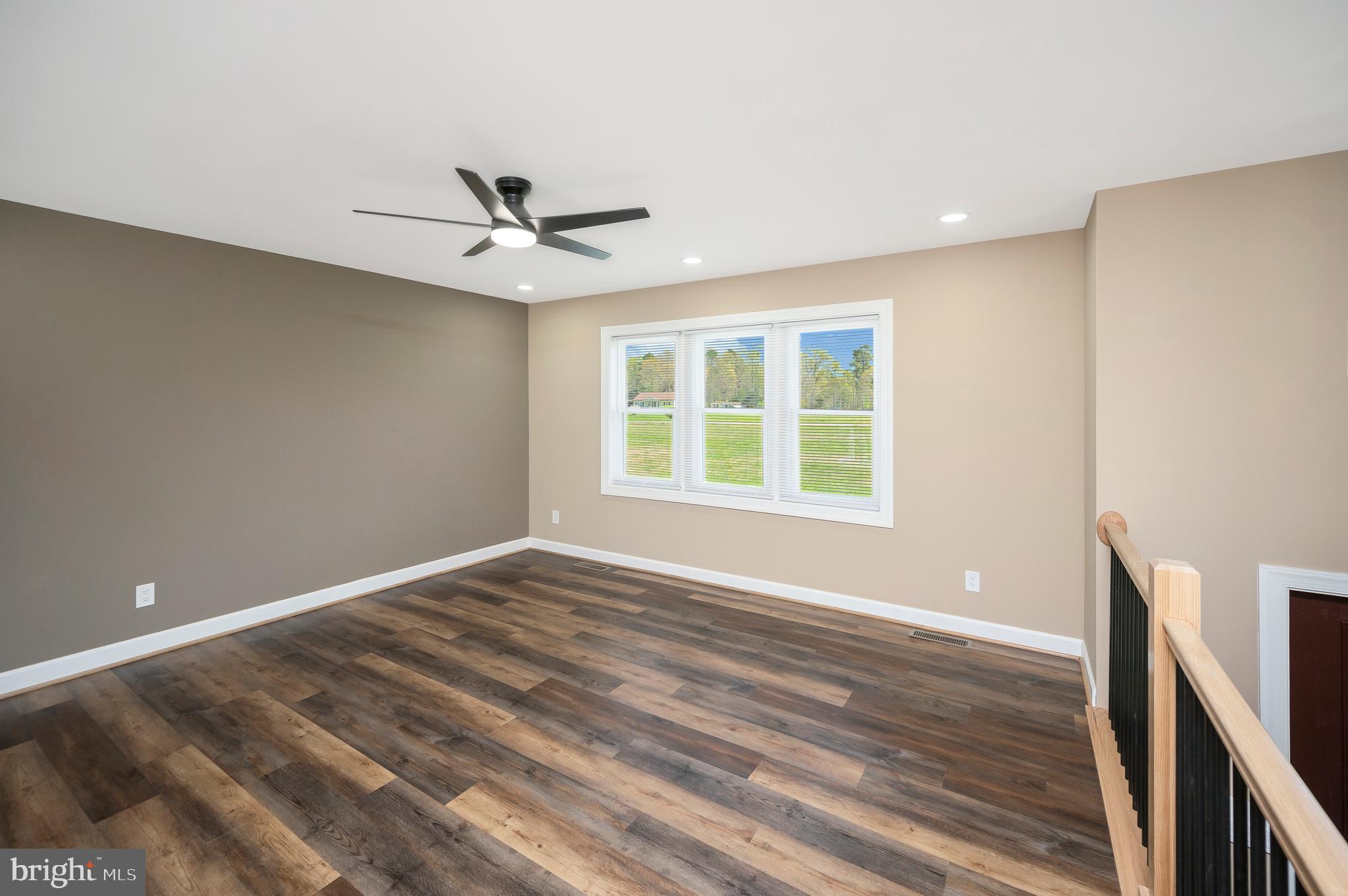13452 Post Oak Road Spotsylvania, VA 22551 - Photo 17 of 56 wooden floor in an empty room with a window
