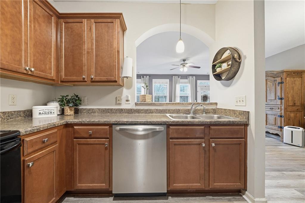 615 Myers Gate Road Ball Ground, GA 30107 - Photo 11 of 43 a kitchen with stainless steel appliances granite countertop a stove a sink and a cabinets