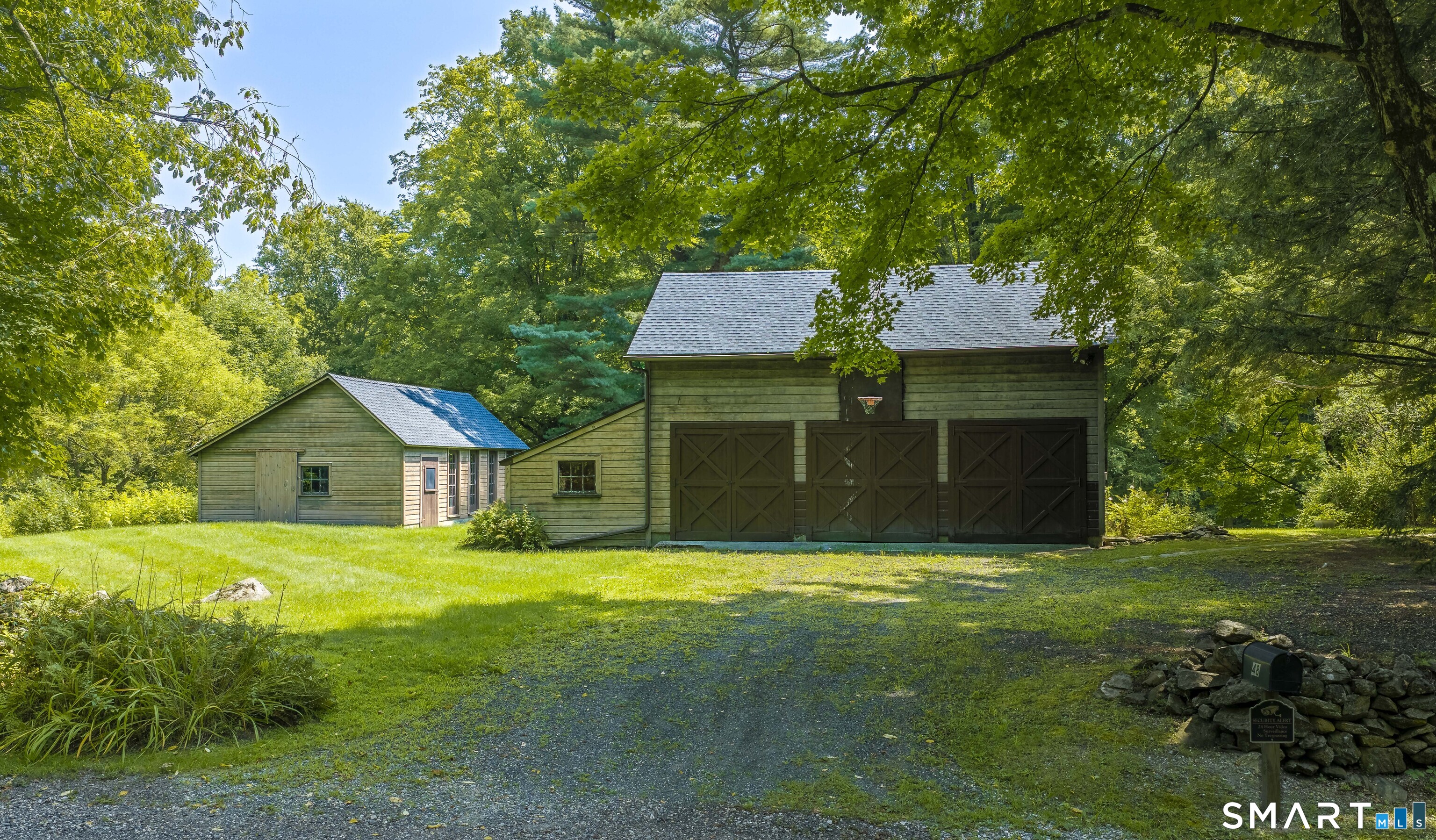 48 Keeler Road Sharon, CT 06069 - Photo 36 of 40 A detached barn that serves as a two-car garage with ample parking in front.