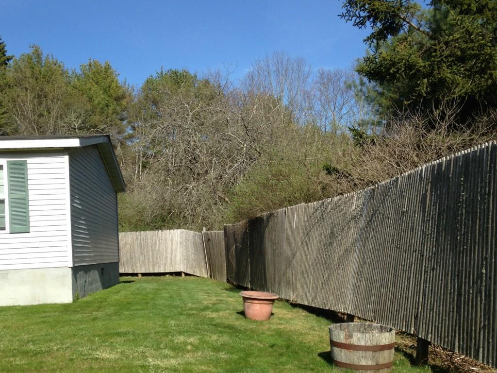 258 Back Narrows Road Boothbay, ME 04537 - Photo 28 of 28 The side lawn and fencing extends...