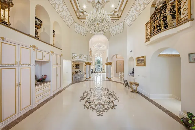 a view of a dining room with furniture and chandelier