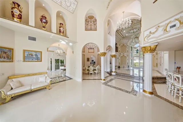 a spacious bathroom with a tub a sink and a large mirror