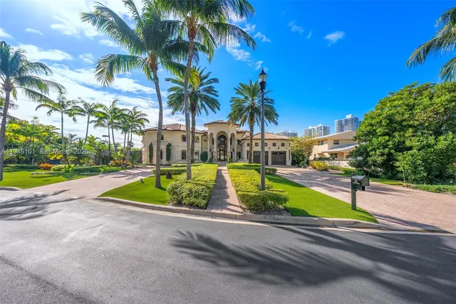 a view of a swimming pool with palm trees