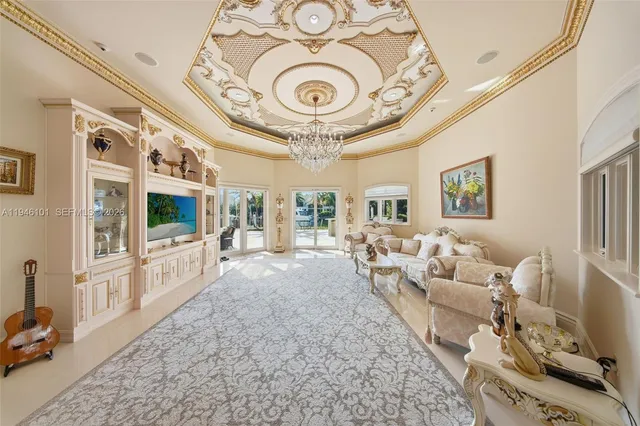 a living room with a couch and a chandelier