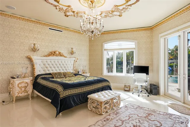 a view of a white house with a yard and palm trees