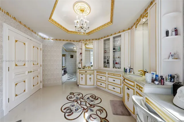 an aerial view of a house with a lake yard kitchen and outdoor seating