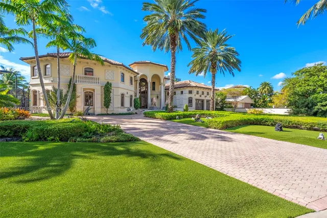 a living room with fireplace furniture and a chandelier