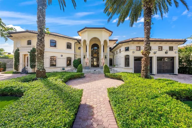 a living room with furniture and a large mirror