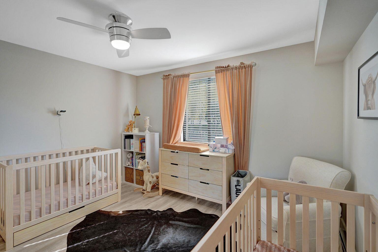 6193 Balboa Circle, Unit 201 Boca Raton, FL 33433 - Photo 41 of 62 a bedroom with furniture and a window