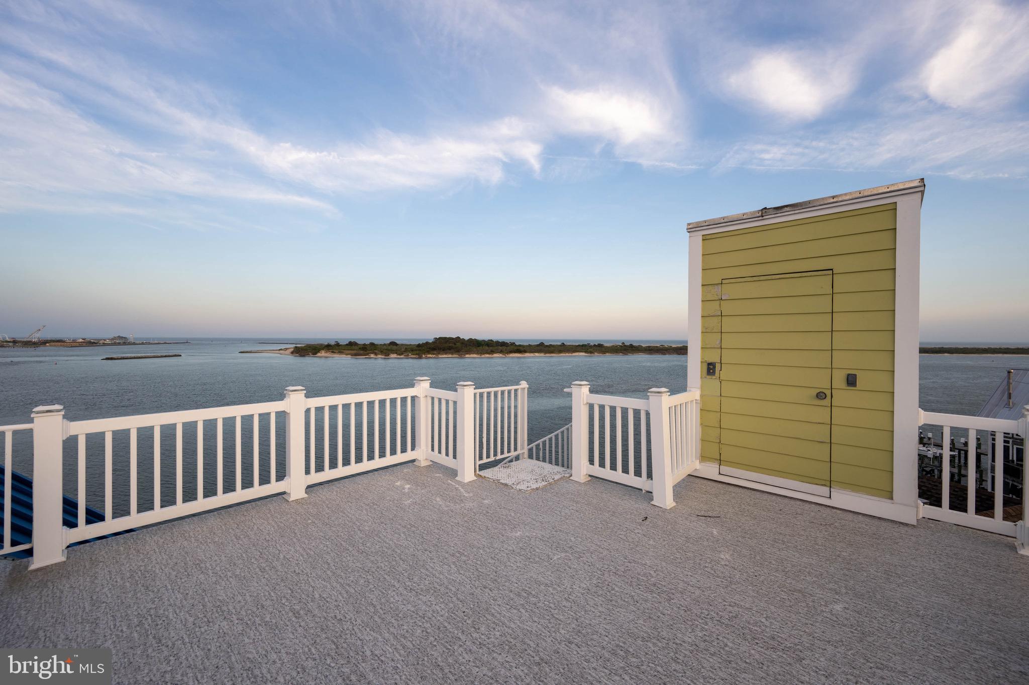 12959 Harbor Road Ocean City, MD 21842 - Photo 43 of 85 a view of balcony with furniture