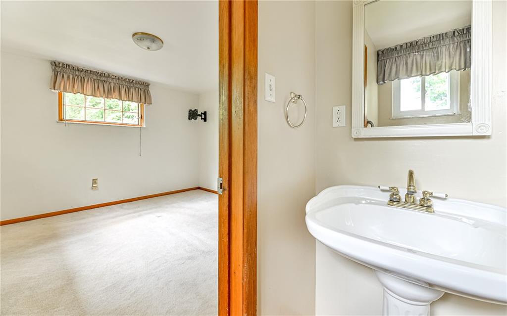 20 Gordon Street McKees Rocks, PA 15136 - Photo 13 of 25 a bathroom with a sink and a mirror