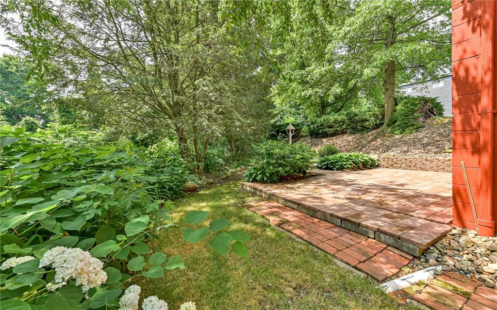 20 Gordon Street McKees Rocks, PA 15136 - Photo 23 of 25 a view of a yard with plants and large trees