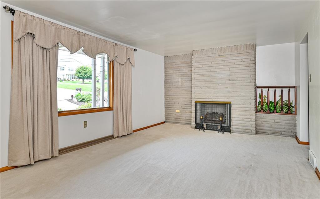 20 Gordon Street McKees Rocks, PA 15136 - Photo 7 of 25 a view of an empty room with a fireplace and a window