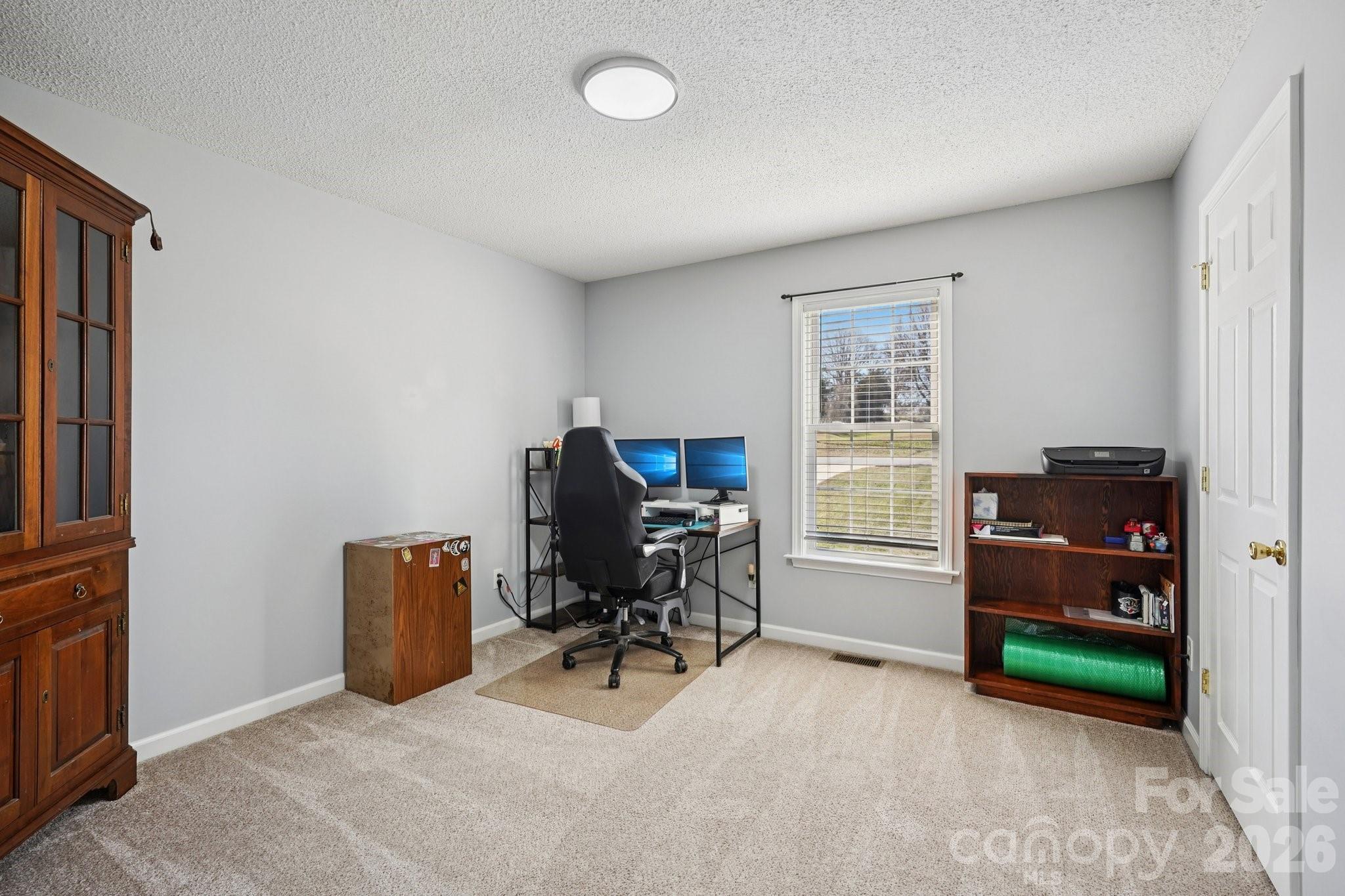 3802 Babe Lane Vale, NC 28168 - Photo 16 of 27 a view of a workspace with furniture and a window