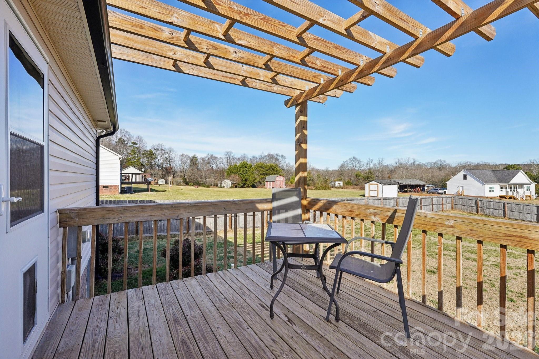 3802 Babe Lane Vale, NC 28168 - Photo 18 of 27 a view of a balcony with furniture and wooden floor