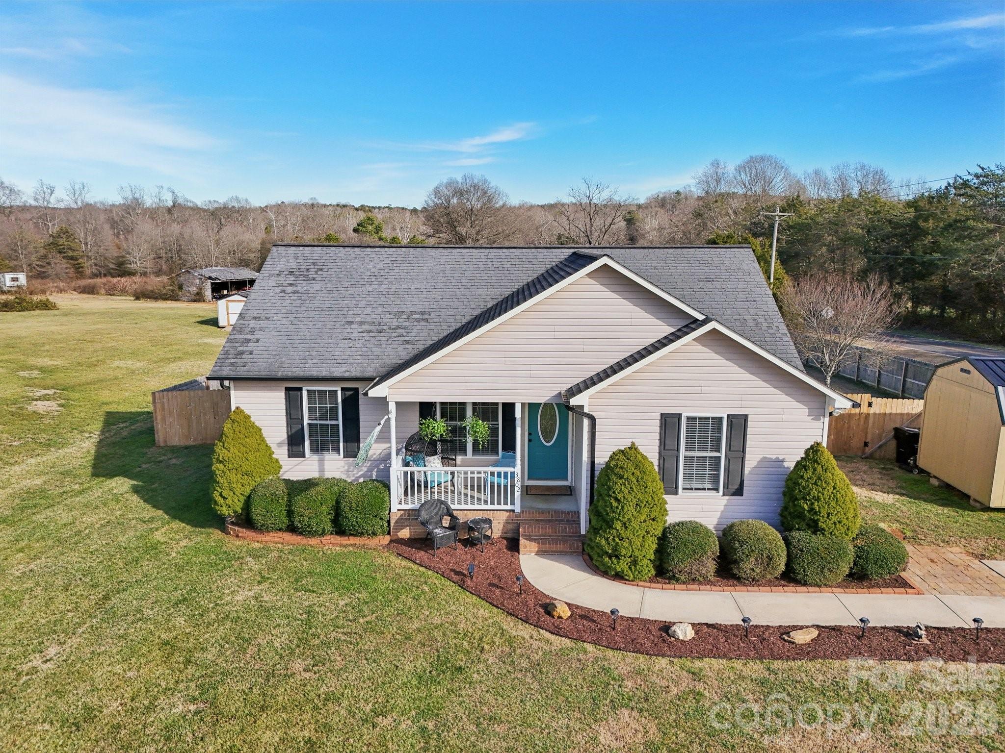3802 Babe Lane Vale, NC 28168 - Photo 24 of 27 a view of a house with a yard and potted plants