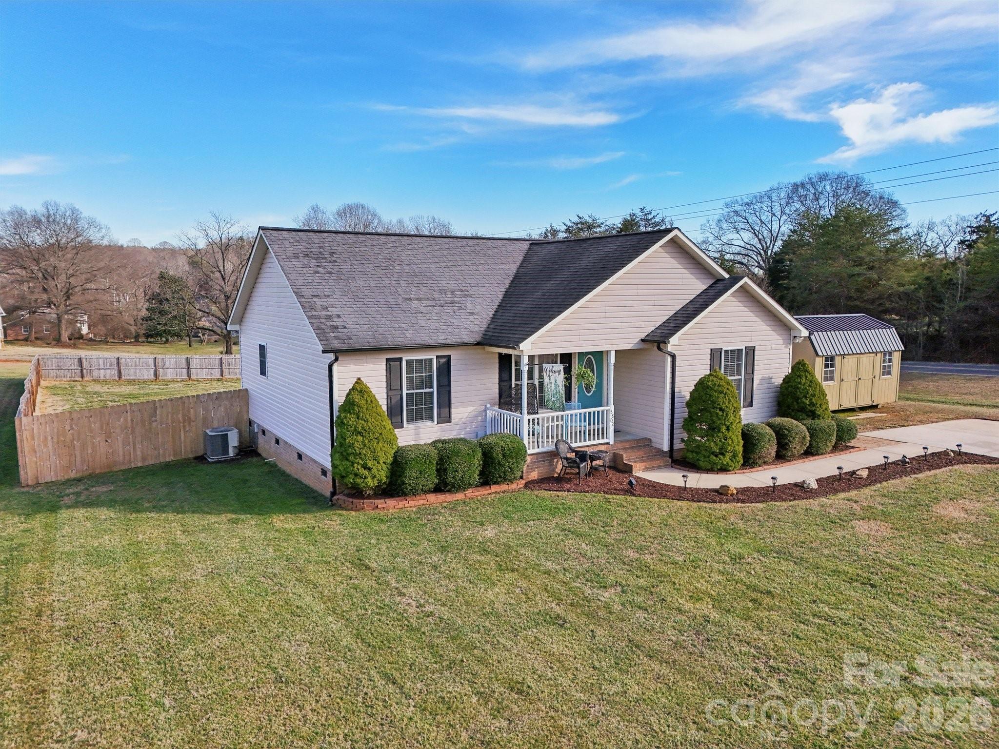 3802 Babe Lane Vale, NC 28168 - Photo 25 of 27 a view of a house with a yard and sitting area