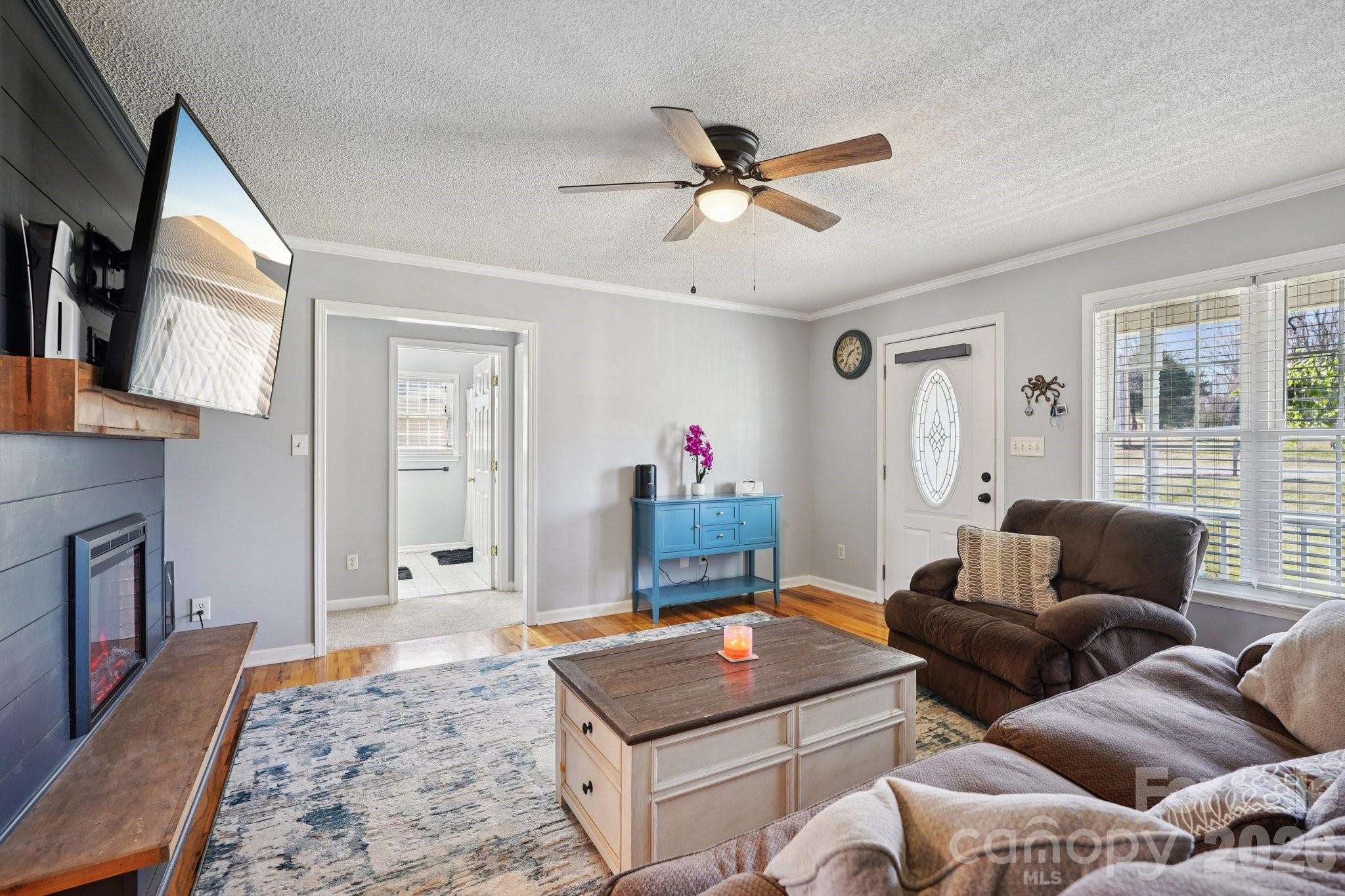 3802 Babe Lane Vale, NC 28168 - Photo 5 of 27 a living room with furniture a flat screen tv and a window
