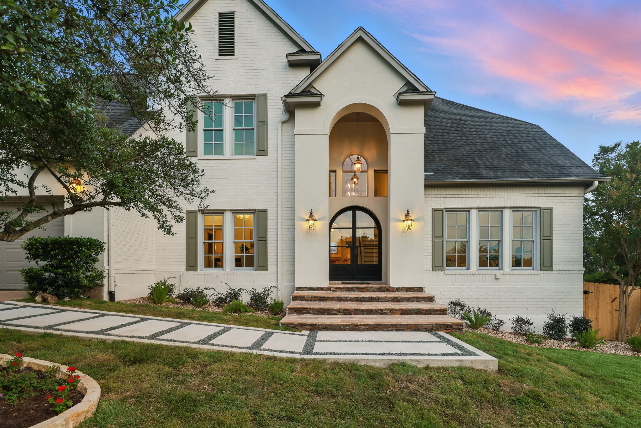 6905 Rudi Cove Austin, TX 78759 - Photo 3 of 36 a front view of a house with a yard