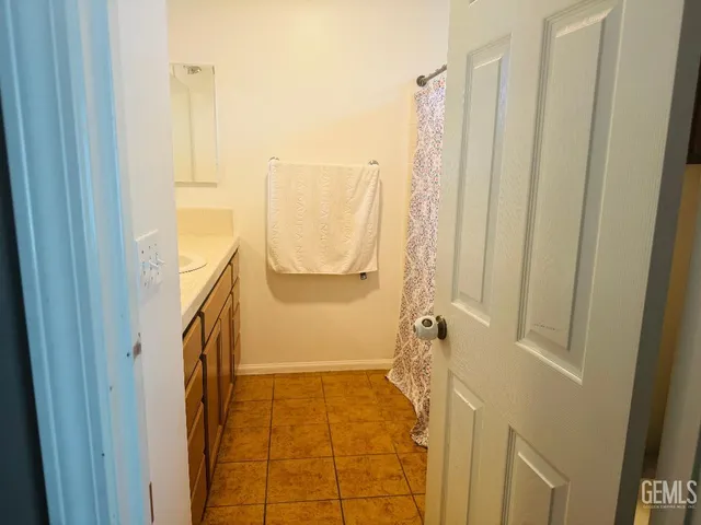 a bedroom with a bed and a television