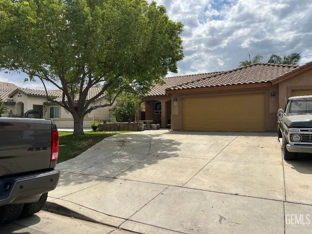 a front view of a house with garage