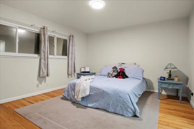 a bathroom with a granite countertop sink a toilet and a mirror