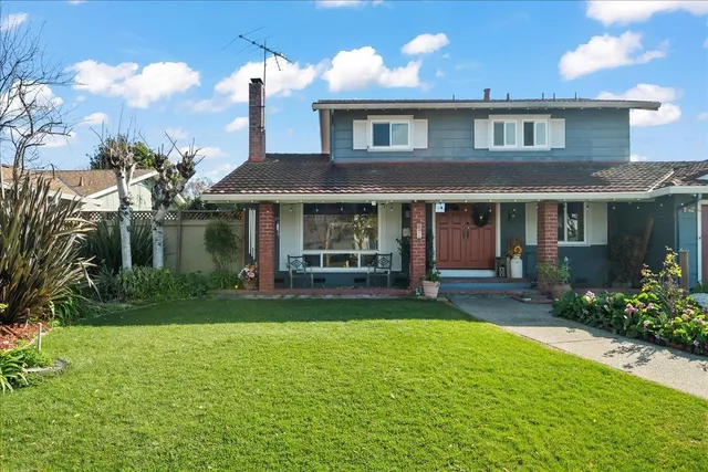 a view of a house with a street