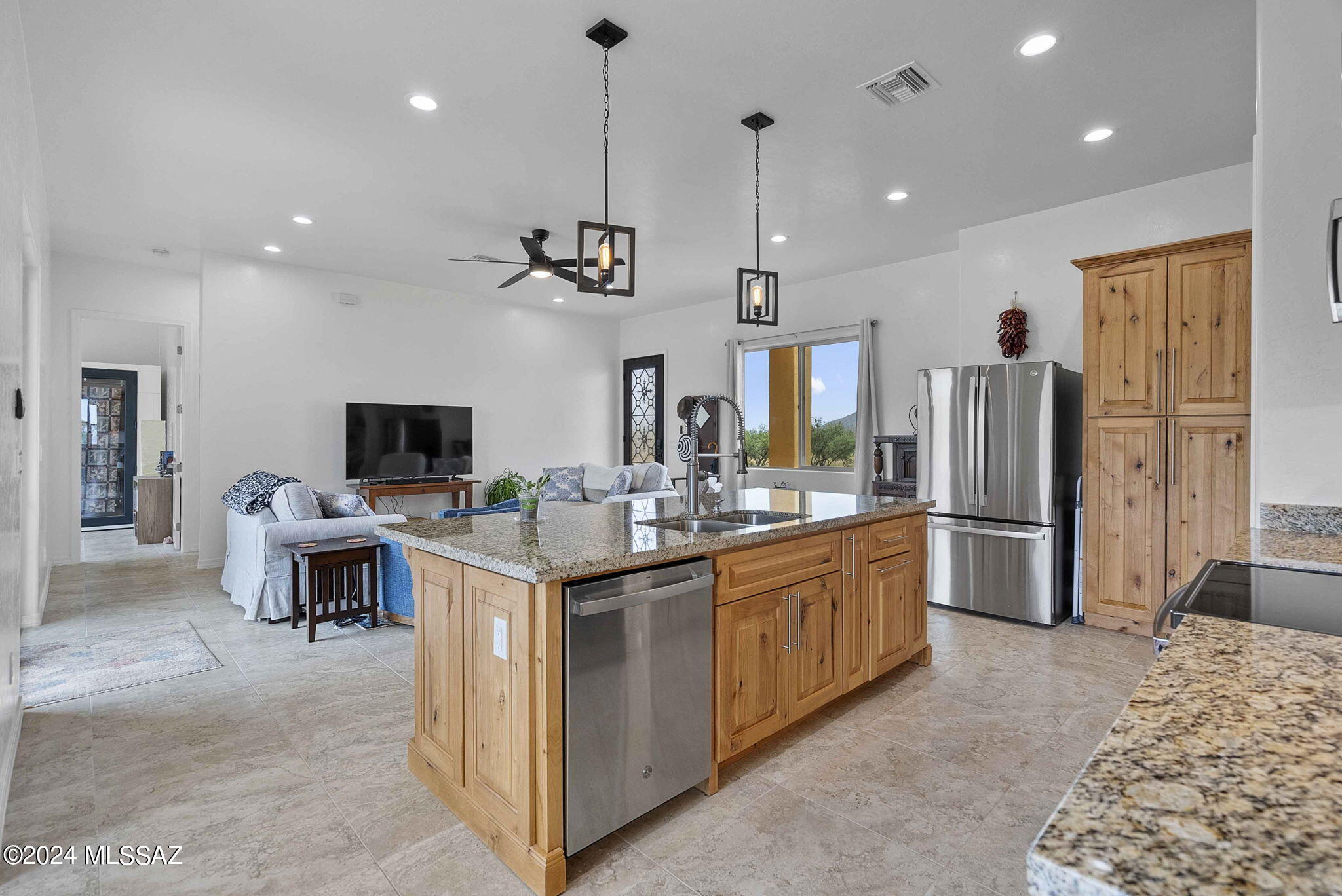22 Vigas Lane Rio Rico, AZ 85648 - Photo 6 of 40 a kitchen with stainless steel appliances kitchen island a sink and cabinets