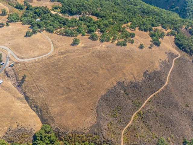 an aerial view of mountain with beach