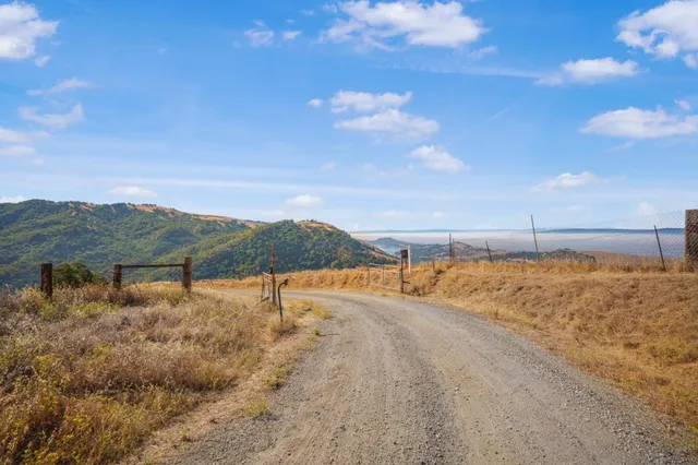 a view of a dry yard with mountain