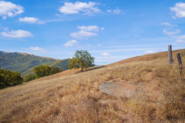 an aerial view of a houses with a yard